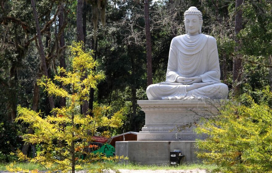 The Enlightenment Buddha statue depicts the time Guatama Buddha sat under a tree and meditated until he became enlightened. It was erected outside A Nan Temple in February 2017. (Gabrielle Rueda/WUFT News)