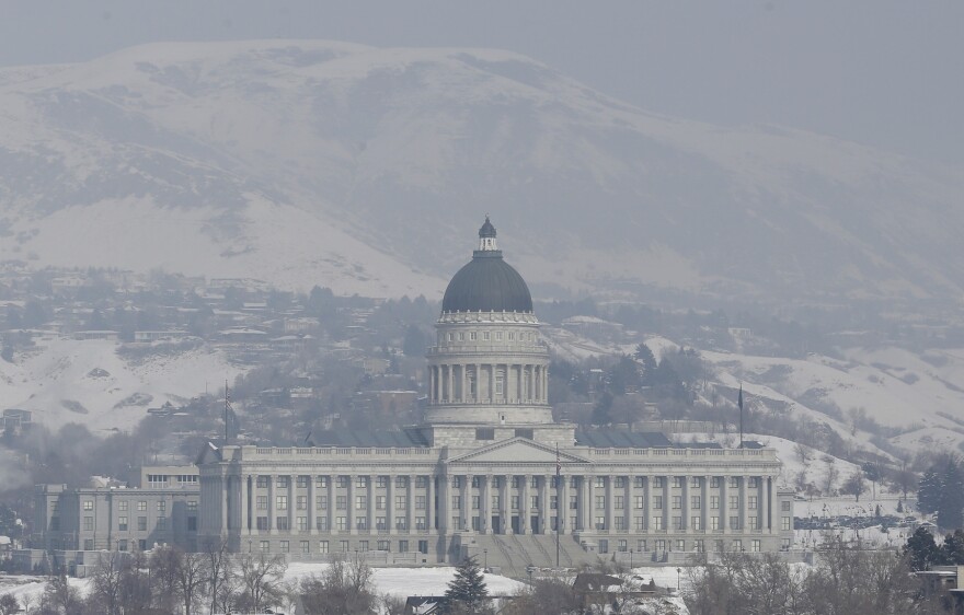 Smog from an inversion hangs over the Utah State Capitol Wednesday, Jan. 23, 2013, in Salt Lake City. The U.S. Environmental Protection Agency has singled out the greater Salt Lake region as having the nation's worst air for much of January, when an icy fog smothers mountain valleys for days or weeks at a time and traps lung-busting soot. (AP Photo/Rick Bowmer)