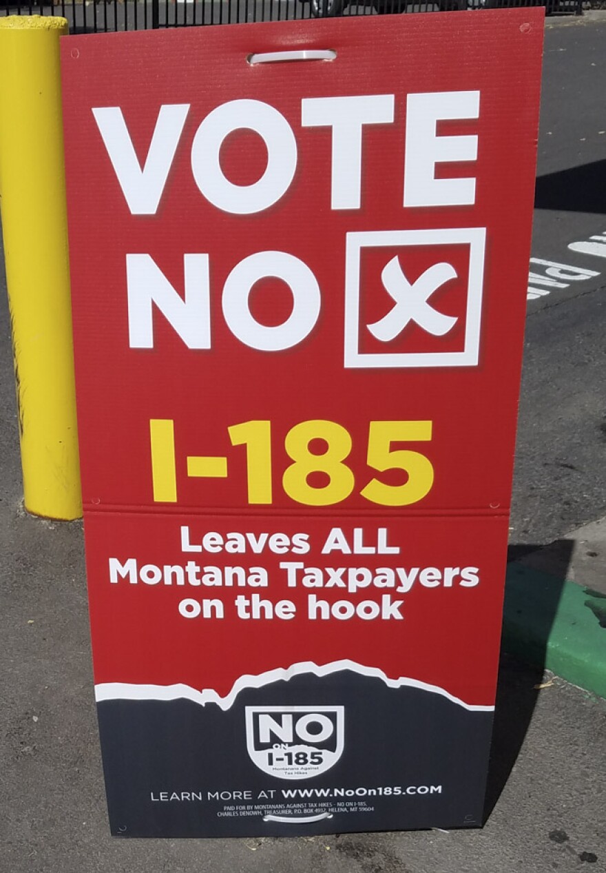 A 'no on I-185'" sign at a Missoula gas station.