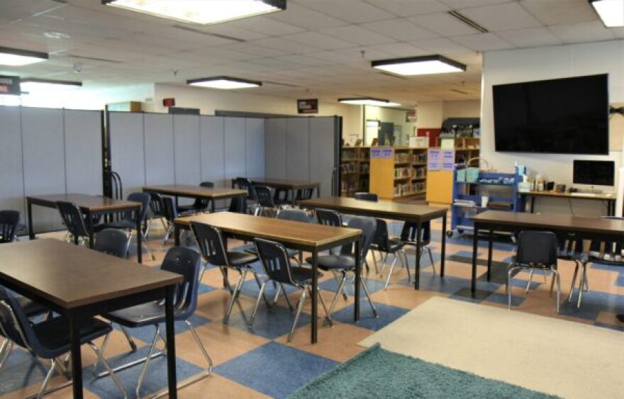 Room dividers separate the library area from the main hallway. Principal Sheila Sweetsir says noise travels easily when other classes walk by. (Photo by: Katie Anastas/Alaska Public Media)