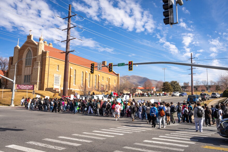 After walking out of East High, student protestors crossed 1300 E to walk up to Sunnyside Park, Feb. 6, 2026. There were so many students that it took a couple of light cycles to get them all across.