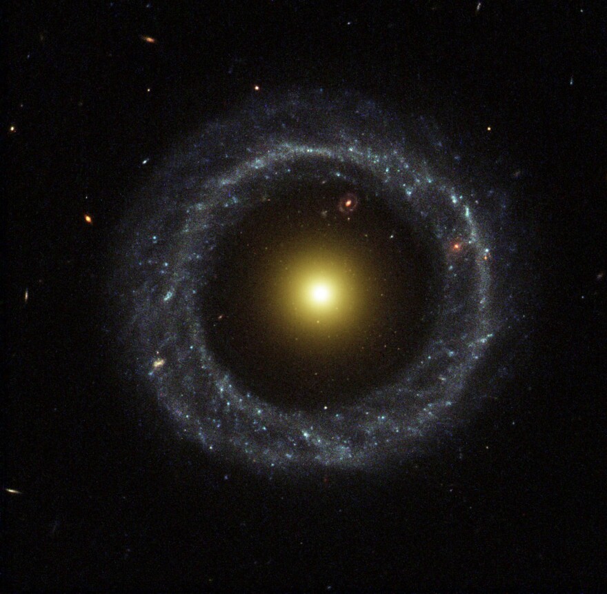 With a perfectly symmetrical ring circling a red sphere of stars, Hoag's object is one of the prettiest mysteries in the universe. (Image credit: NASA/ESA, Processing: Benoit Blanco)