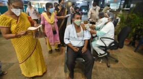 A man being vaccinated against COVID-19, at a district hospital in Noida, India. (Sunil Ghosh/Hindustan Times via Getty Images)