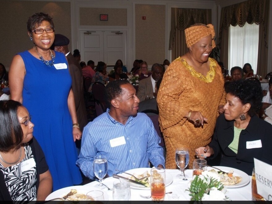 Carol Fowler (in blue dress) at the dinner her family turned into a charity event after her daughter's wedding was canceled.