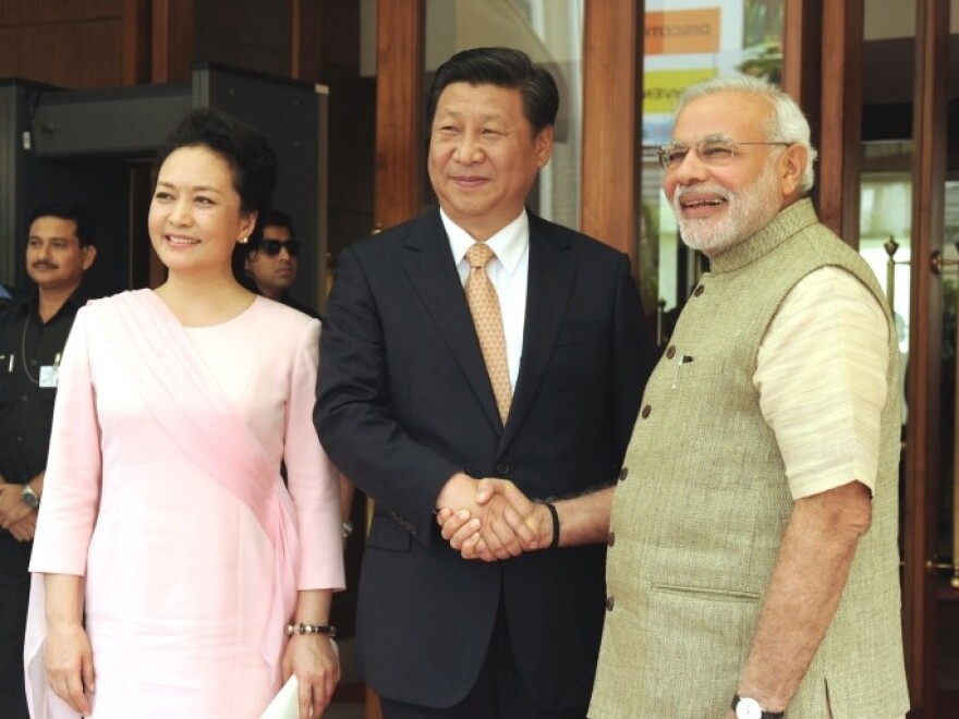 India's prime minister Narendra Modi greets Chinese President Xi Jinping, September 17, 2014