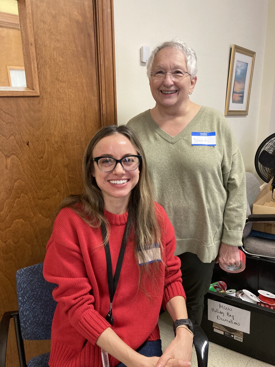 Volunteers Liz Skalka (L) and Brenda Kemp (R) help make goodie bags for Frederick County’s Meals-on-Wheels recipients.
