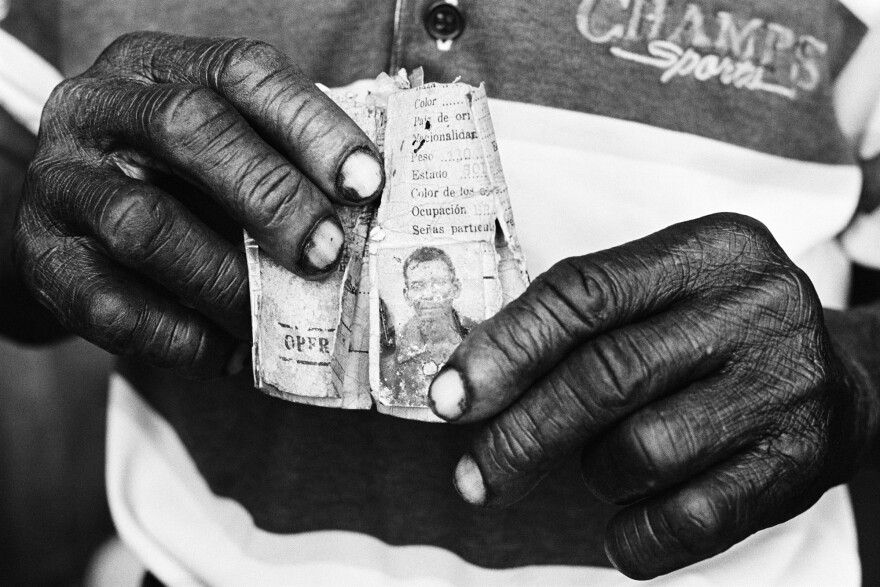 These hands belong to a 67-year-old man who's lived in the Dominican Republic for over 50 years — one of the thousands of people of Haitian descent who are stateless. Constantine learned that a company ID card, issued decades ago, is the man's only piece of identification.