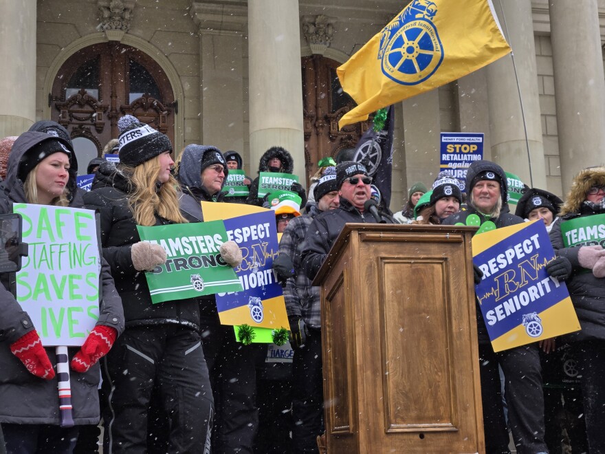 Kevin Moore, president of Teamsters Michigan, speaks on the steps of the Michigan Capitol on Tuesday, March 17, 2026.