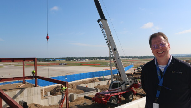 Cherry Capital Airport director Kevin Klein on the roof of Concourse A, overlooking construction of Concourse B. (Photo : Austin Rowlader / IPR News)
