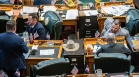 Colorado lawmakers chat among themselves on the last day of the 2025 legislative session.