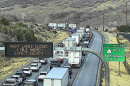 Westbound vehicles queued in a line behind a semi truck fire on the right shoulder of Interstate 80 after the East Canyon exit.