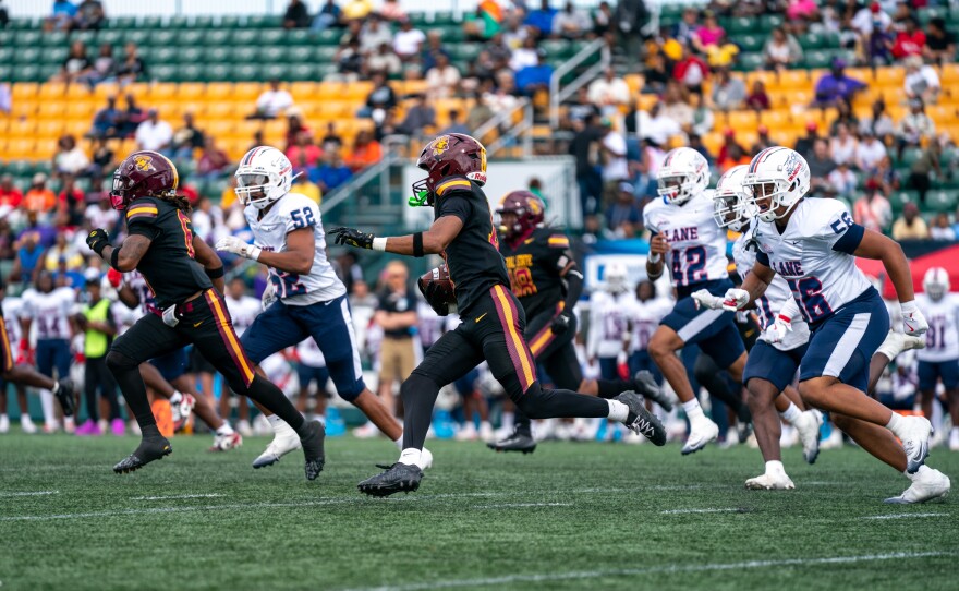 A CSU football player runs down the field with the ball during the Frederick Douglass HBCU Football Classic at the Rochester Community Sports Complex in Rochester, on Saturday, Sept. 27, 2025.