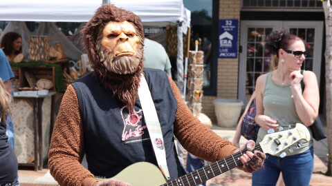 Bigfoot playing acoustic guitar