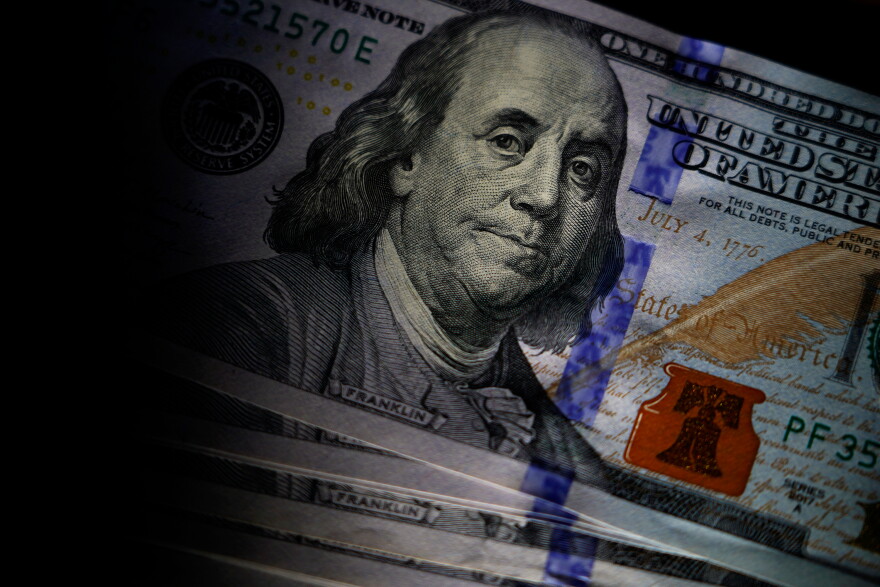 FILE - A portrait of Benjamin Franklin is featured on a U.S. $100 bill in Marple Township, Pa., on July 14, 2022.