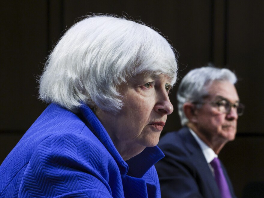 Treasury Secretary Janet Yellen, left, and Federal Reserve Chairman Jerome Powell appear before a Senate Banking, Housing and Urban Affairs Committee hearing on Sept. 28. Yellen warned the government would run out of cash to pay its bills by Oct. 18 unless Congress raises the so-called debt ceiling.