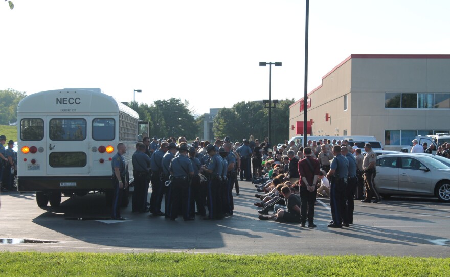 Missouri Department of Corrections bus arrives after protesters are arrested after the I-70 shutdown on August 10 