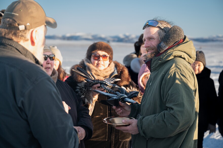 An Iditarod musher receives an award