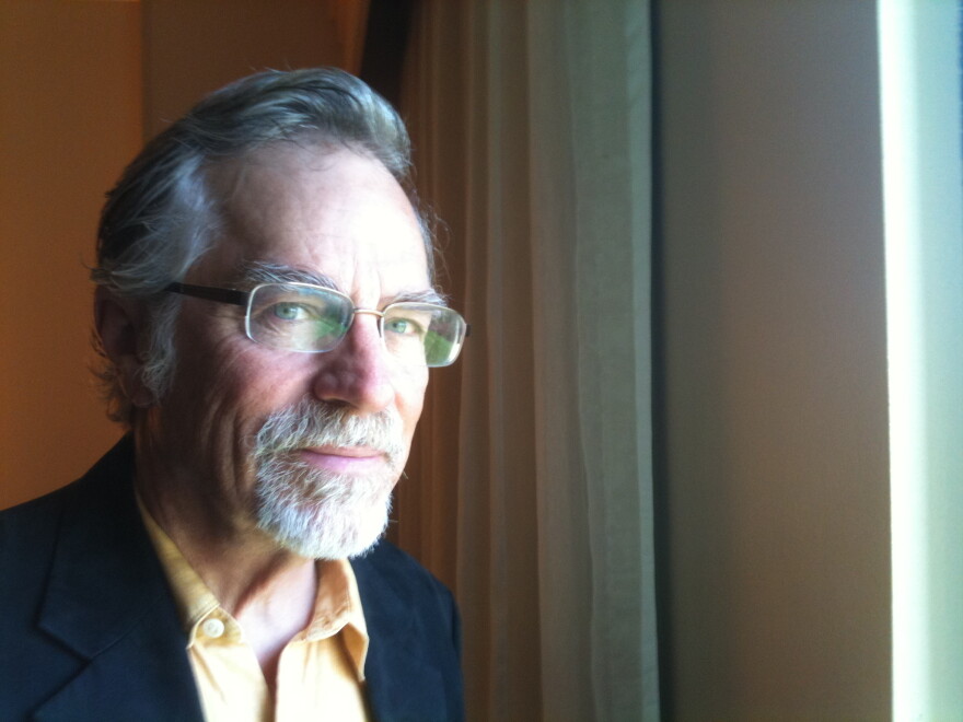 Greg Pape from the chest up, facing camera, wearing glasses.