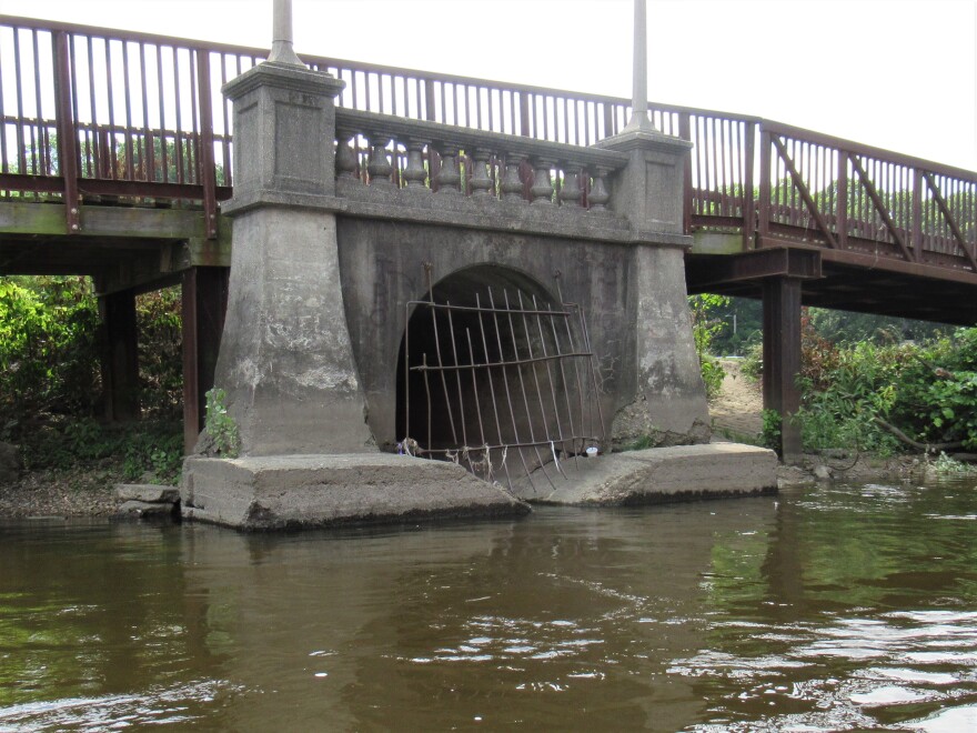 An outlet pipe on the Grand River in Lansing.