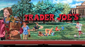 FILE - The Trader Joe's logo hangs on a mural, Aug. 13, 2019, in Cambridge, Mass. (AP Photo/Charles Krupa, File)