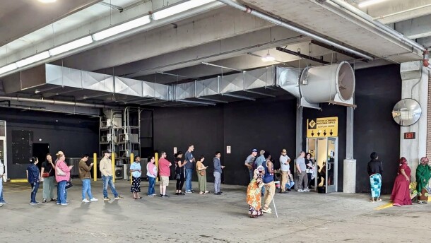Kentuckians visiting the Bowling Green regional driver's license center waited in a line that snaked from the office to the the adjacent parking garage on Apr. 22, 2025.