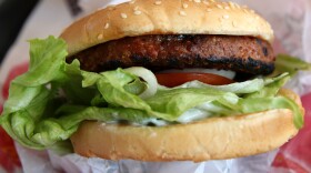 A Beyond Meat burger is displayed at a Carl's Jr. restaurant in San Francisco. The rise of meat alternatives made from plants, as well as meat grown from animal cells in labs, has sparked new laws on food labeling.