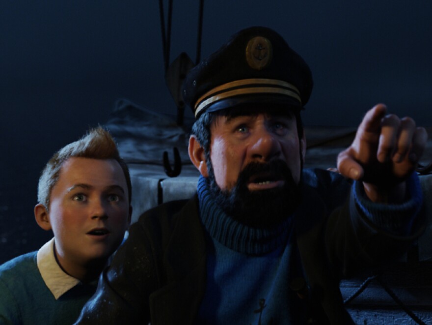 The young journalist Tintin (Jamie Bell, left) and the permanently drunk Captain Haddock (Andy Serkis<em></em>) go on a global treasure chase in <em>The Adventures of Tintin: Secret of the Unicorn. </em>