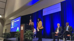 Gov. Maura Healey delivers remarks during the Massachusetts Municipal Association's annual meeting at the Hynes Convention Center on Friday, Jan. 19, 2024. She's joined on stage by Lt. Gov. Kim Driscoll.