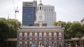 People move past Independence Hall at the Independence National Historical Park in Philadelphia, Thursday, Aug. 25, 2016. (Matt Rourke/AP)