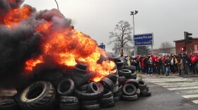 French workers burn tires outside the Goodyear tire factory in Amiens, France, on Tuesday, after Titan CEO Maurice Taylor criticized French workers in a letter addressed to Industrial Renewal Minister Arnaud Montebourg.