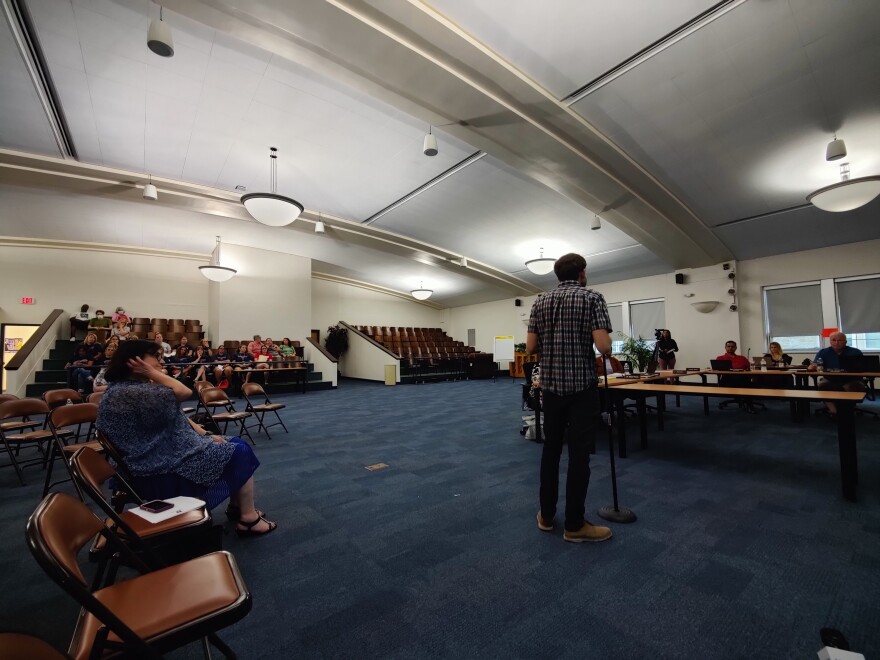 Parents and school staff at a Binghamton City School District board meeting in July. (Megan Zerez/WSKG)