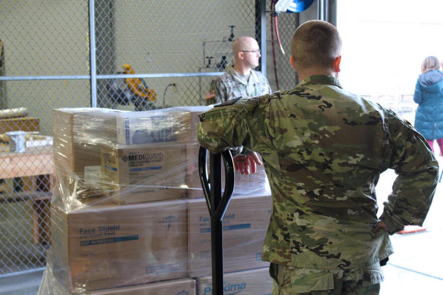 Members of Indiana's National Guard distribute supplies from the Strategic National Stockpile for hospitals across the state in April. The Guard is now working with the Secretary of State to distribute PPE to polling places