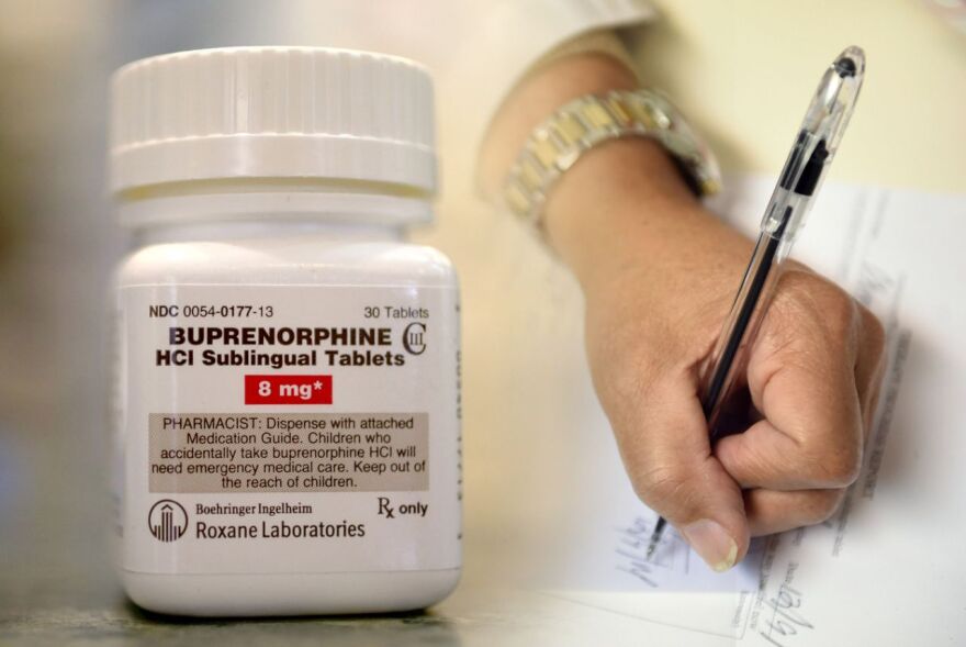 A physician writes a prescription for buprenorphine.