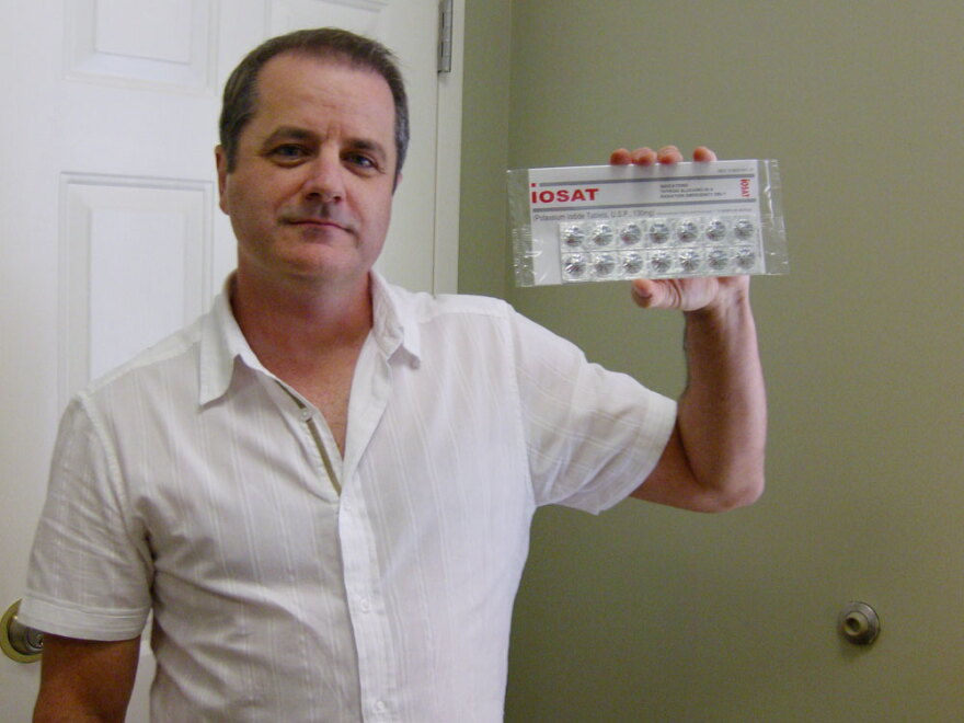 Troy Jones, who runs NukePills.com, holds a package of potassium iodide pills. Jones brokered a $1 million deal with the Ministry of Health in Kuwait earlier this year.