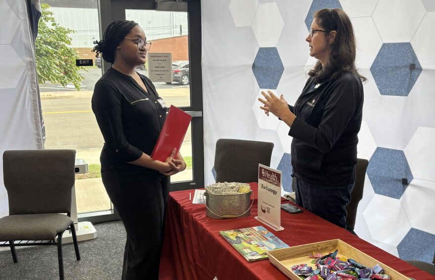 Nara Sykes speaks with a volunteer from OU Health at a celebration for students who participated in Future Forward. The new mentoring project guides students on their resumes, interviewing and workplace expectations.