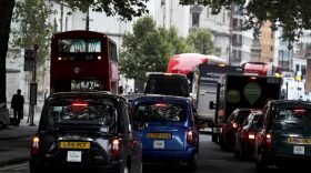 Vehicles drive in central London, Wednesday, July 26, 2017. Britain is pledging to ban the sale of new gas- and diesel-powered cars by 2040. (Kirsty Wigglesworth/AP)