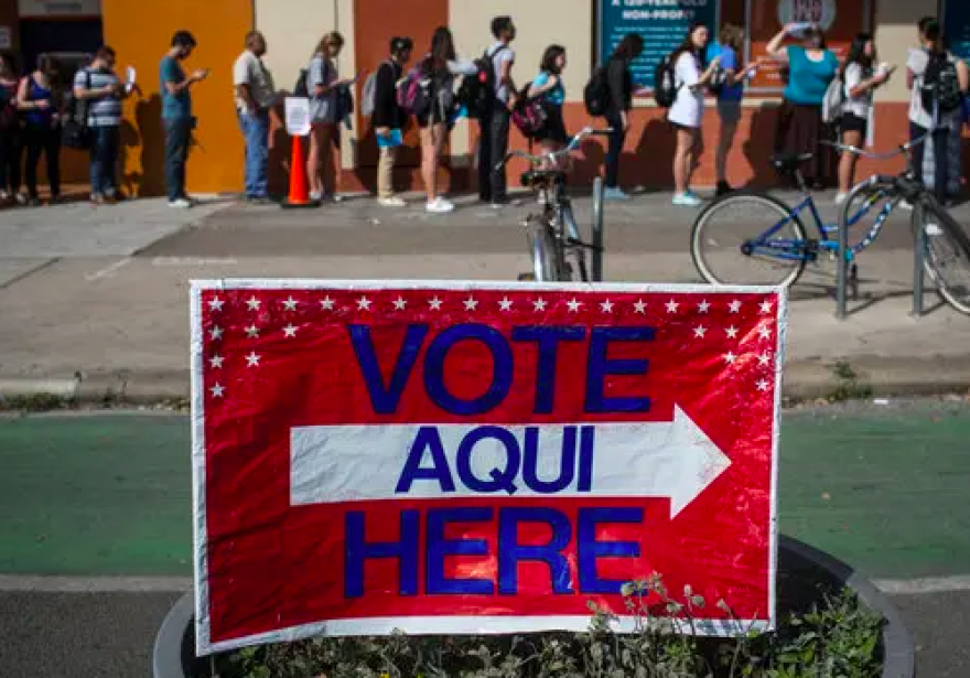 A bilingual voting sign outside a precinct in Texas.