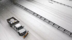A snow plow drives on Interstate 395, Saturday, Dec. 19, 2009, in Alexandria, Va.