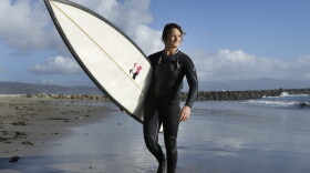 Bianca Valenti walks on the beach after surfing waves at Mavericks, Friday, Dec. 4, 2015, in Half Moon Bay, Calif. (Ben Margot/AP)