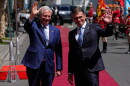 Bolivian President Rodrigo Paz, right, and Chile's President Jose Antonio Kast wave outside at the government palace in La Paz, Bolivia, Friday, Oct. 16, 2026. (AP Photo/Juan Karita)