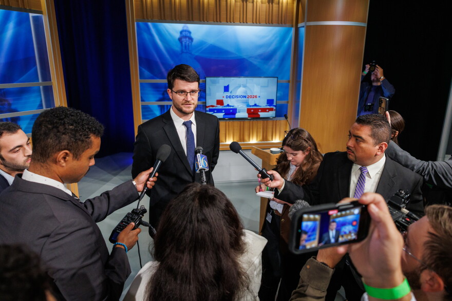 Democratic nominee for U.S. House William Lawrence speaks to reporters at WKAR's studios in East Lansing, Mich., after the first head-to-head debate with U.S. Rep. Tom Barrett, R-Charlotte, on Oct. 6, 2026.