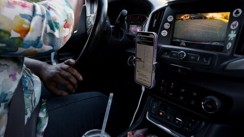 Jaquelyn “Jackie” King, a rideshare driver for the company Uber, backs out of a driveway in Gainesville, Fla., on Thursday, Nov. 20, 2025.