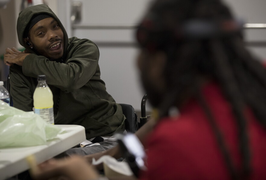 Deonte Gay, 30, is one of the younger attendees of the weekly Urban Re-Entry Group meetings. Since losing the use of his legs, Davis has learned to swim, skied and traveled. He credits the shooting for turning his life around for the better.