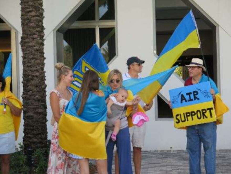 Supporters of Ukraine attend a rally in Sunny Isles, FL, in March 2022.(WUSF)