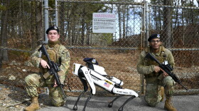 Cape Cod Space Force Station received an unmanned ground vehicle in the form of a semi-autonomous "dog" meant to enhance their base security protocols on Feb. 24, 2023. Automated robotic security firm, Asylon Inc., will partner with the 6th Space Warning Squadron, in increasing efficiency of installation security. The squadron will benefit in being provided assets, in the form of the robotic security dog and charging station, to maintain high tempo perimeter security operations for deterrence and real time intelligence. The UGV nicknamed Spot, poses with two U.S. Air Force defenders while on patrol during a demonstration on its first day of duty.