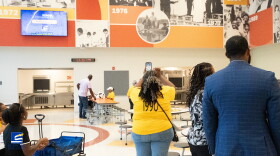 Alumni, staff and community members tour the new John F. Kennedy Middle School on July 31, 2026, in Suffolk, Virginia.
