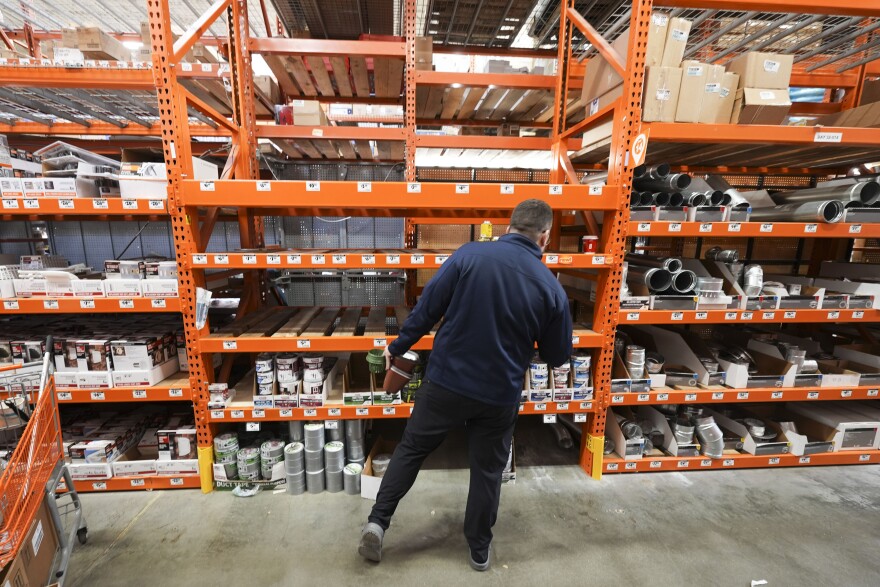 A customer looks for pipe insulation where the shelves are now empty inside a Home Depot, as people prepare for a rare and historic snowstorm in Baton Rouge, La., Monday, Jan. 20, 2025. (AP Photo/Gerald Herbert)