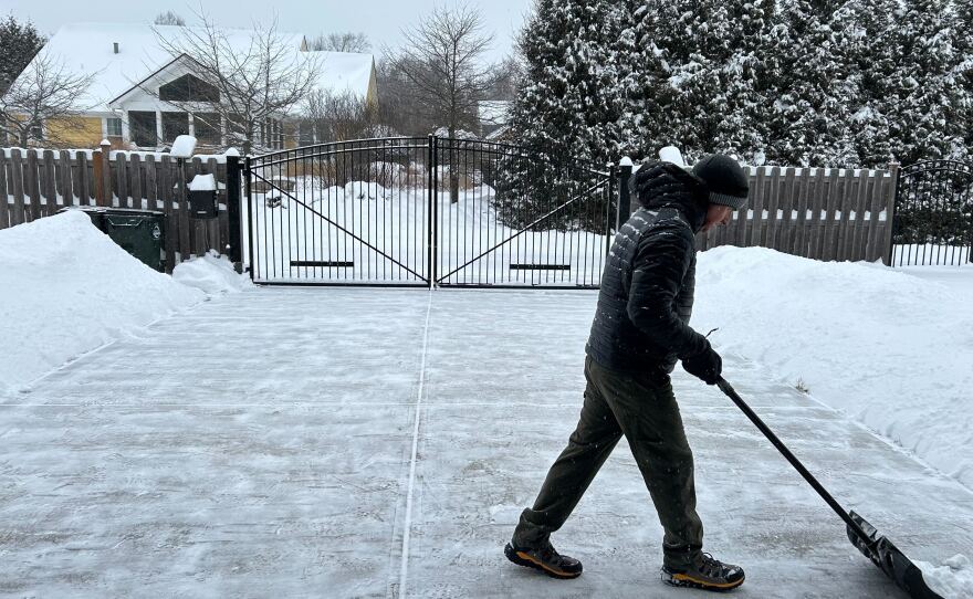 Stephen Rumbaugh shoveling his driveway in Yellow Springs on Sunday afternoon.