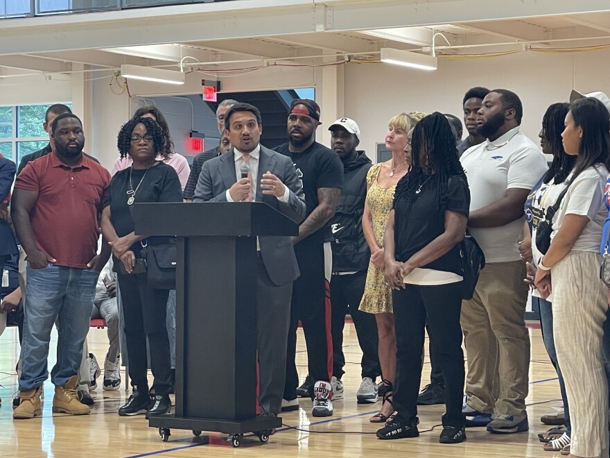 Surrounded by members of youth sports and wellness programs, Akron Mayor Shammas Malik talks about new grant funding for the groups during a news conference at Ed Davis Community Center on July 16, 2025.