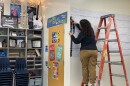 Music teacher Dina Linaro puts the finishing touches on her classroom Thursday, Aug. 6 ahead of the new school year.